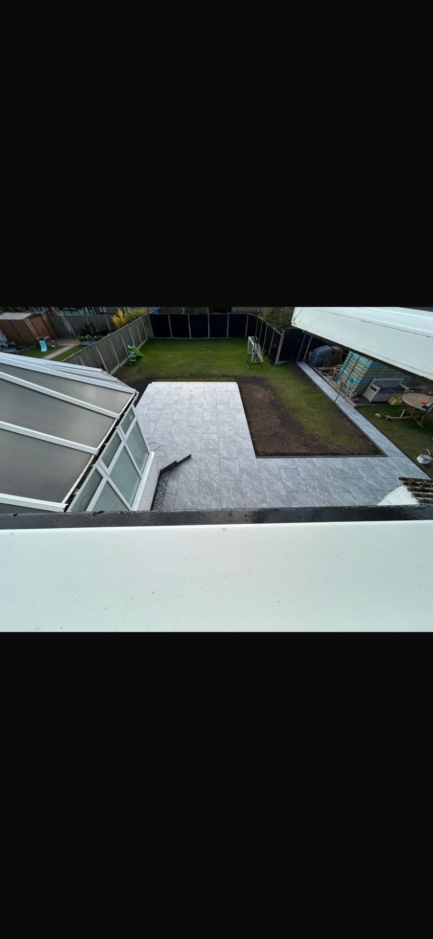 Aerial view of the completed Gretna porcelain patio and lawn area